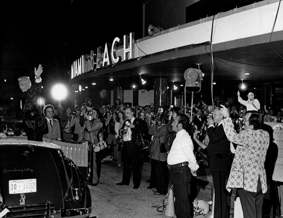Desi Arnaz waves to fans at an arrival at his daughter’s premiere in an event in Miami Beach in an undated photo.