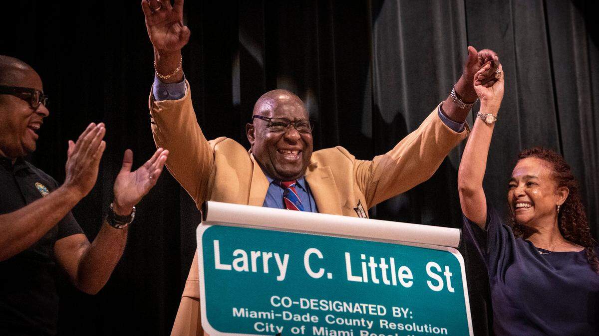 Larry Little, center, and Miami Dade County Commissioner Keon Hardemon and Miami City Commissioner Christine King, right, celebrate after the Larry C. Little street sign was unveiled during a street naming ceremony held at the Booker T. Washington High School auditorium on March 27. Friends, former teammates and elected officials attended the ceremony. Northwest 14th Street between Seventh Avenue and First Avenue is now “Larry C. Little Street.”