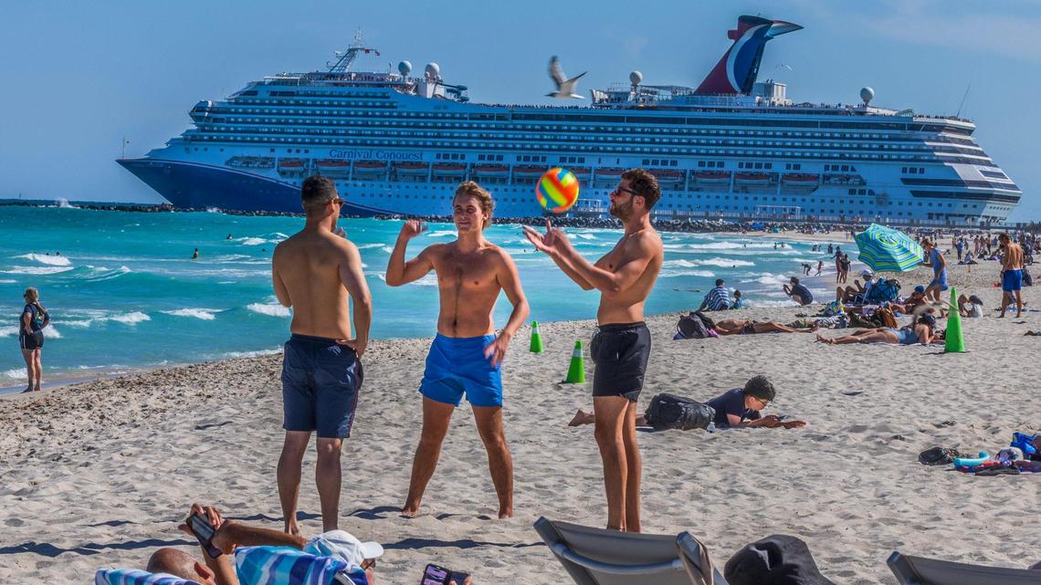 The Carnival Conquest cruise ship departs from PortMiami through the Government Cut channel as beachgoers enjoy the nice weather in South Beach, during the spring break, in Miami Beach, Florida. on Friday March 21, 2025.