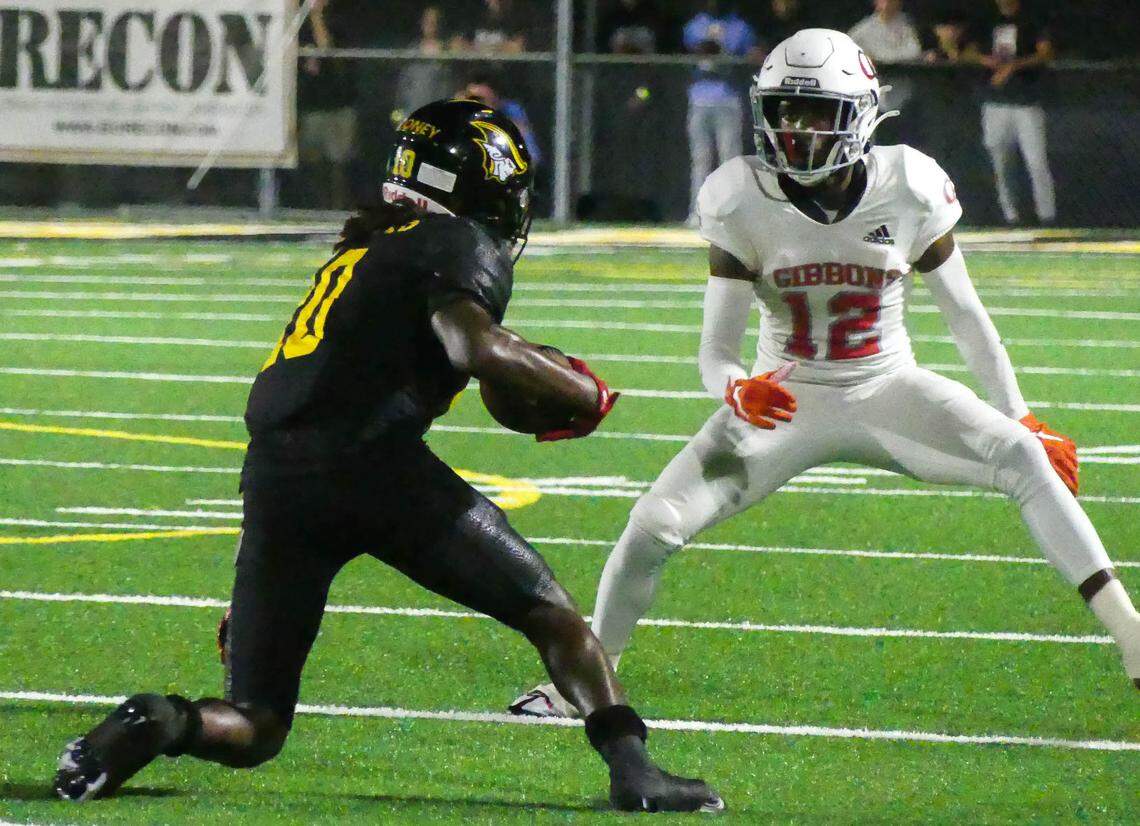 American Heritage had home field advantage in their playoff game against Cardinal Gibbons Friday, Nov. 25th. WR Malachi Toney of the Patriots runs the ball against defender CB Johnel Mauvais of the Chiefs in first half action.