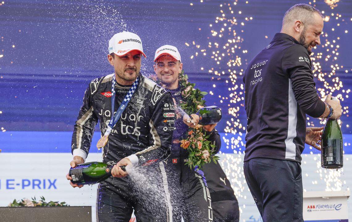 Mitch Evans of Team Jaguar TCS Racing sprays champagne as he celebratres on stage after winning the all electric Formula Miami E-Prix at the Miami International Autodrome at Hard Rock Stadium in Miami Gardens, Florida on Saturday, January 31, 2026.