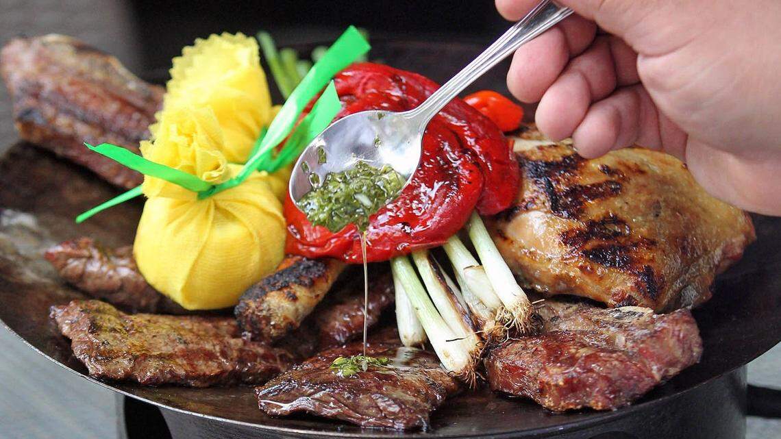 Baires Grill parrilladas include steak, ribs, chorizo, blood sausage, chicken and Chimichurri sauce.