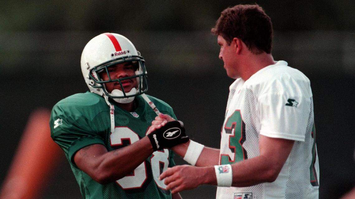 In 1997, the Dolphins’ Calvin Jackson and Dan Marino shake hands.