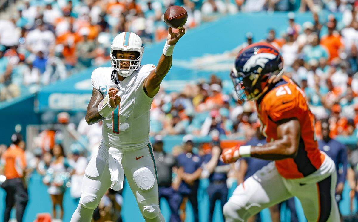 Miami Dolphins quarterback Tua Tagovailoa (1) passes the ball in the first half against the Denver Broncos at Hard Rock Stadium in Miami Gardens on Sunday, September 24, 2023.