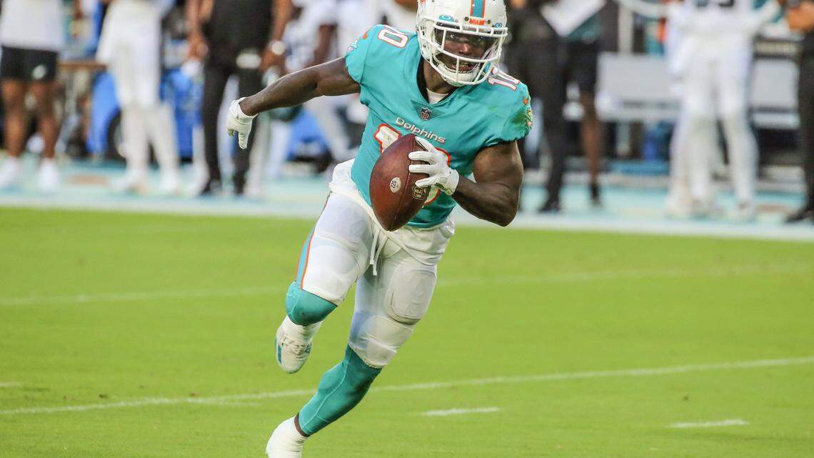 Miami Dolphins wide receiver Tyreek Hill on a pass reception from quarterback Tua Tagovailoa in the first quarter against the Philadelphia Eagles at Hard Rock Stadium in Miami Gardens on Saturday, August 27, 2022.