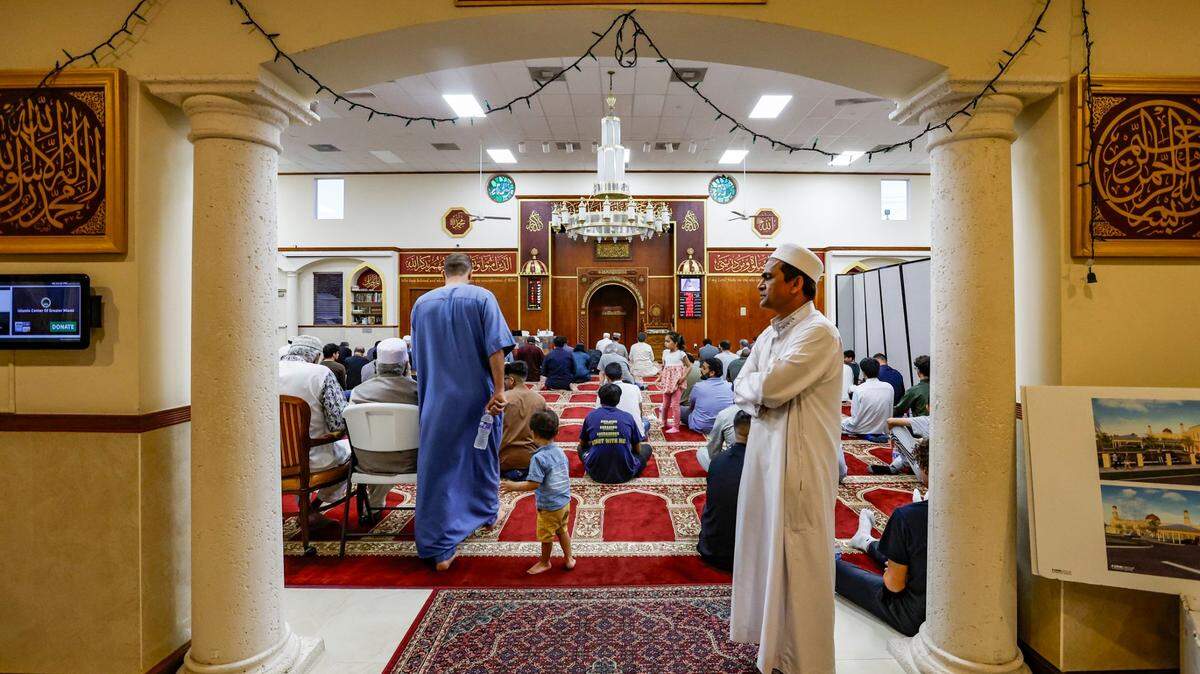 Attendees arrive for Salat al-jama‘ah (Congregational Prayer) for the Day of Arafah at the Islamic Center of Greater Miami-Masjid in Miami Gardens on June 27, 2023.