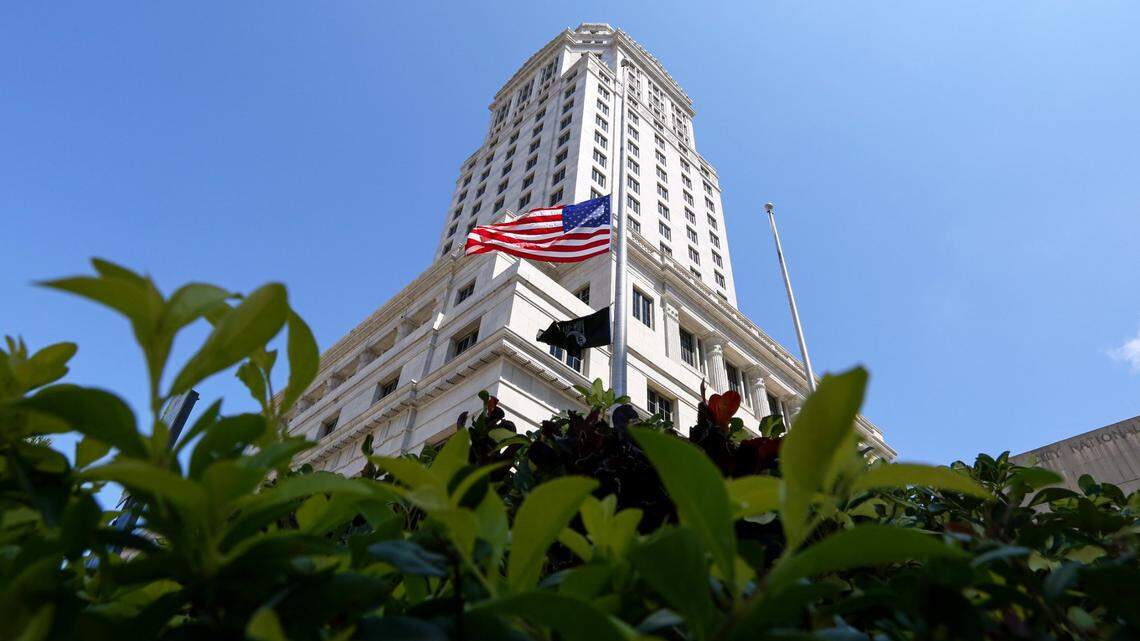 The U.S. flag waves at half-staff to honor the late Justice Ruth Bader Ginsburg outside the Miami-Dade County Courthouse at 73 W. Flagler St., in downtown Miami, Florida, on Sunday, September 27, 2020.