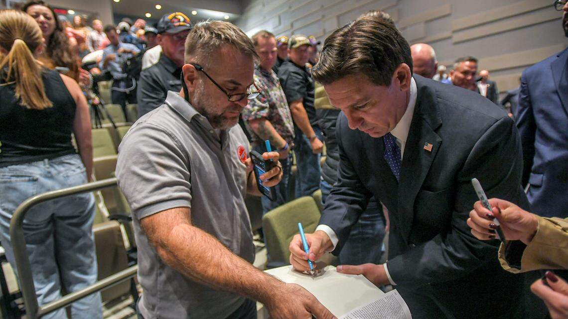 Florida Gov. Ron DeSantis signed an autograph in Anderson, South Carolina, on Oct 19 during a presidential campaign stop.