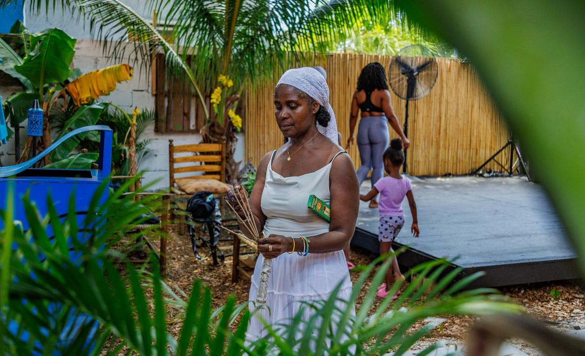 Artist Weiselande ‘Yanui’ Cesar checks details before a dance class at the new Little Haiti visitor center located at 5556 NE 2nd Avenue created to welcome visitors and locals to the neighborhood, in Miami, on Saturday, August 10, 2024.