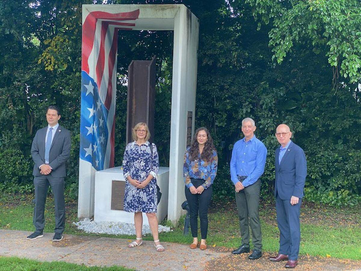 A group gathers at 1814 Brickell Park to pay tribute to 911 heroes alongside a 15-foot-high concrete and steel sculpture designed by artist Christian Bernard that used steel from the World Trade Center. The work was commissioned by former Commissioner Marc Sarnoff and dedicated at the park in 2012.