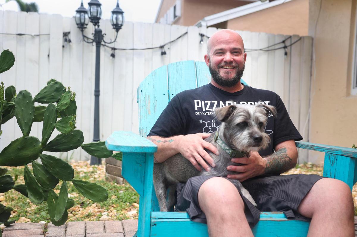 Jameson O’Hanlon, who had an abortion when he identified as female, with his dog, Scully. O’Hanlon said he was grateful to have had the choice to decide but is worried about what is to come after the Supreme Court’s decision to overturn Roe v. Wade.