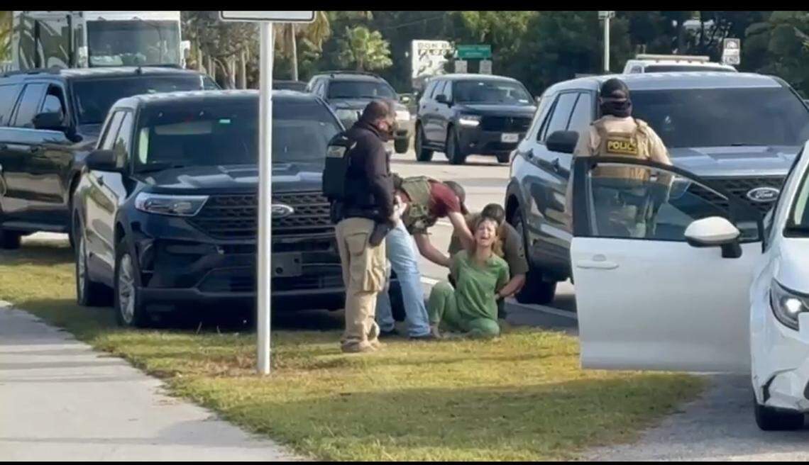 In Key Largo, in front of Pink Plaza at mile marker 103.4, federal immigration agents stopped a woman driving a white Toyota Corolla, yanked her from her car and wrestled her to the ground on Wednesday, Dec. 3, 2025. She was a U.S. citizen.