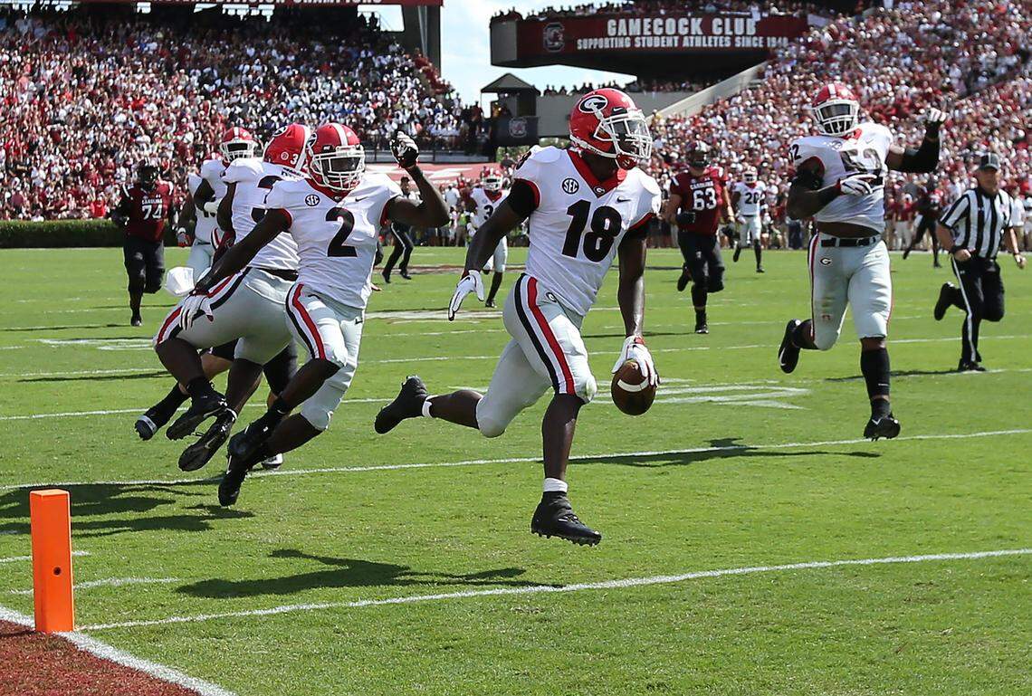 Georgia defensive back Deandre Baker intercepts South Carolina quarterback Jake Bentley on the opening drive and returns it for a touchdown during the first quarter on Saturday, Sept 8, 2018, at Williams-Brice Stadium in Columbia, S.C.
