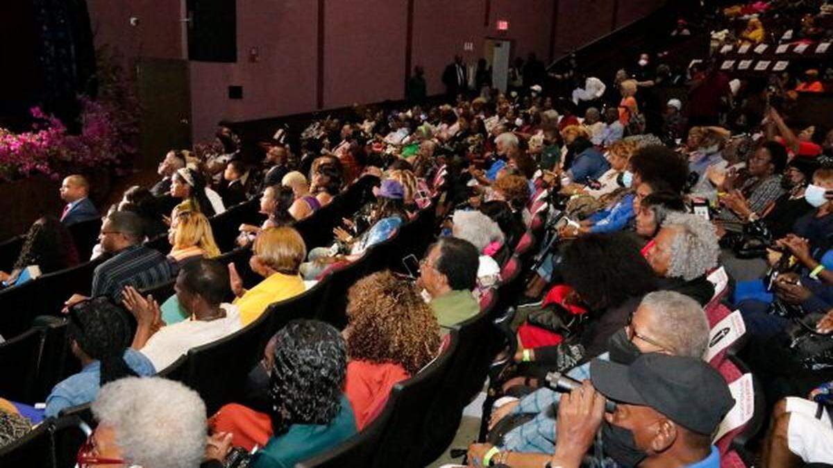 Crowds watch on at Reclaim the Dream Candlelight Memorial and Gospel Concert. The Liberty City nonprofit Martin Luther King Economic Development Corporation holds the event to commemorate Dr. King during the anniversary week of his assassination.