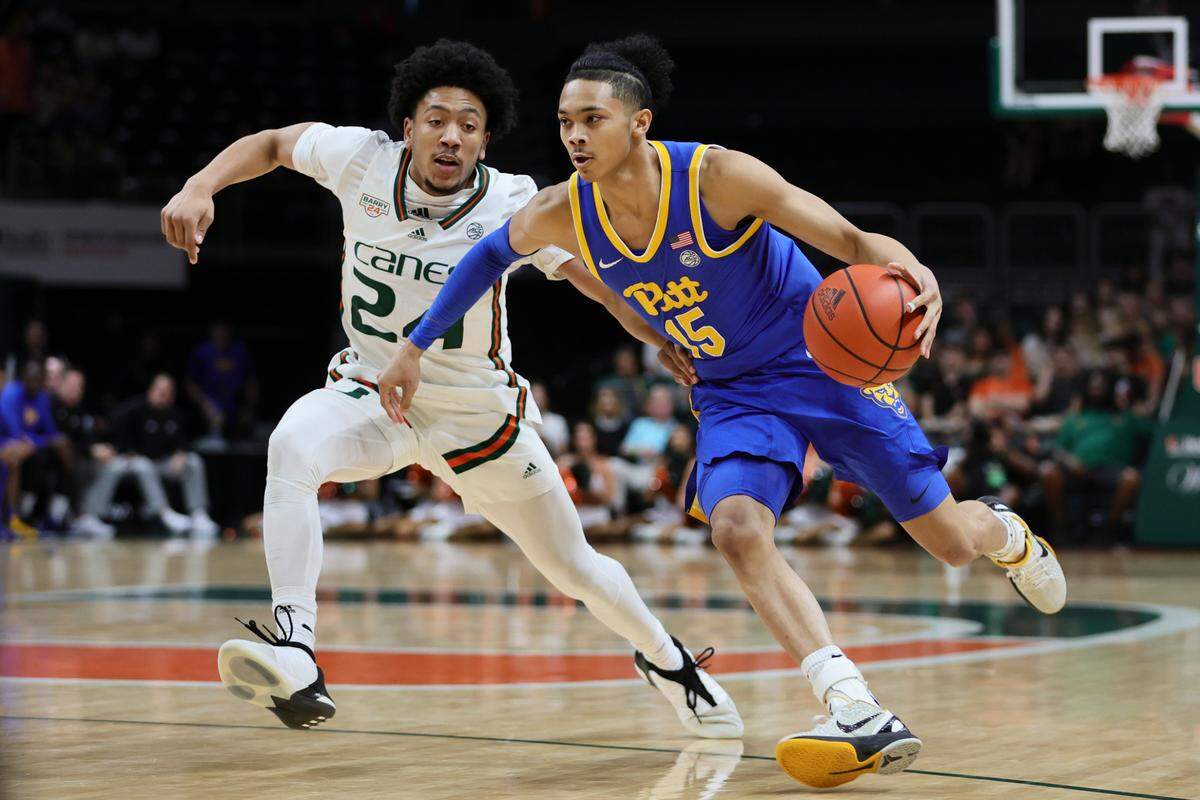 Pittsburgh guard Jaland Lowe (15) drives to the basket past Miami guard Nijel Pack (24) during the first half of a game on Jan. 27, 2024, at the Watsco Center in Coral Gables, Florida.