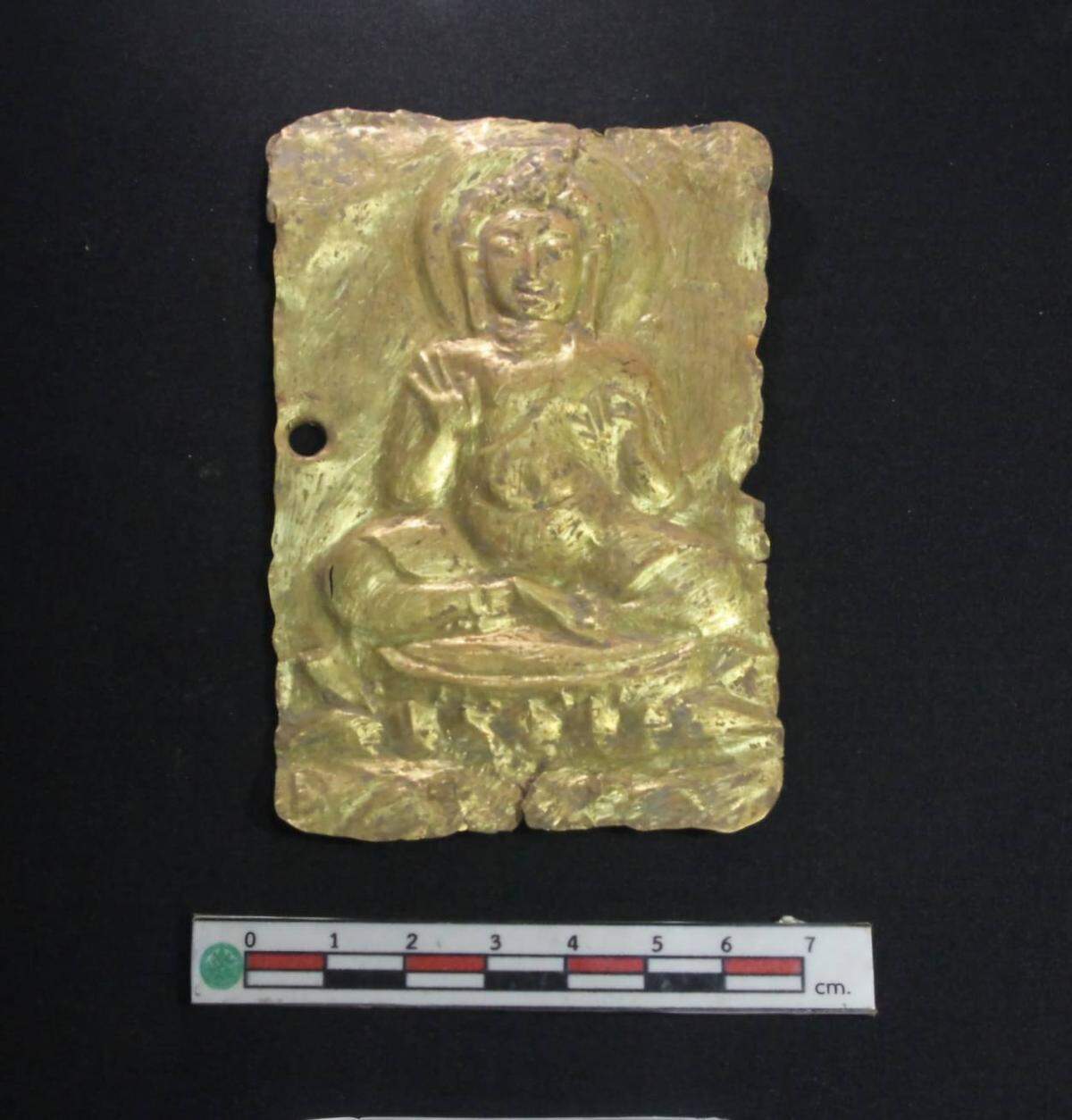 The impression shows Buddha in a teaching position.