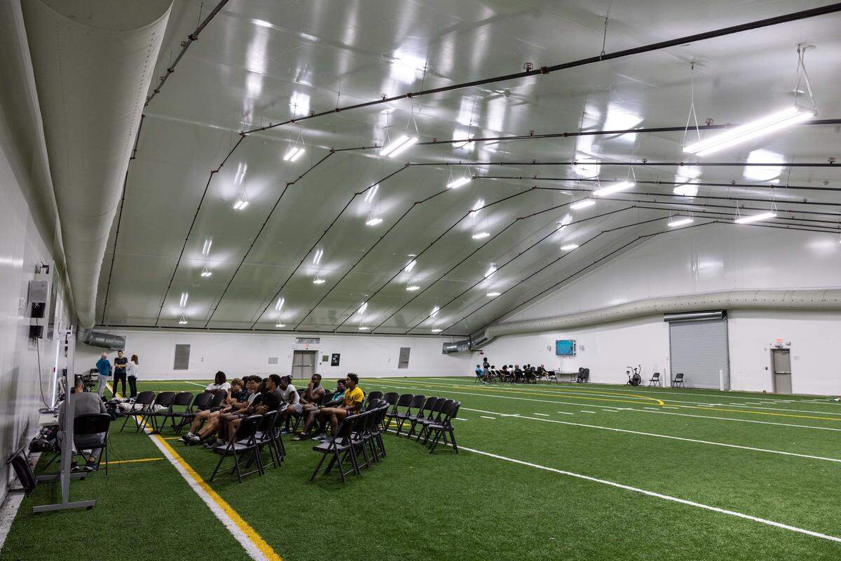 ArchBishop football players watch tape inside the new Jordan Family Foundation Athletic Center at Archbishop McCarthy on Wednesday, October 22, 2025, in Fort Lauderdale, Fla.