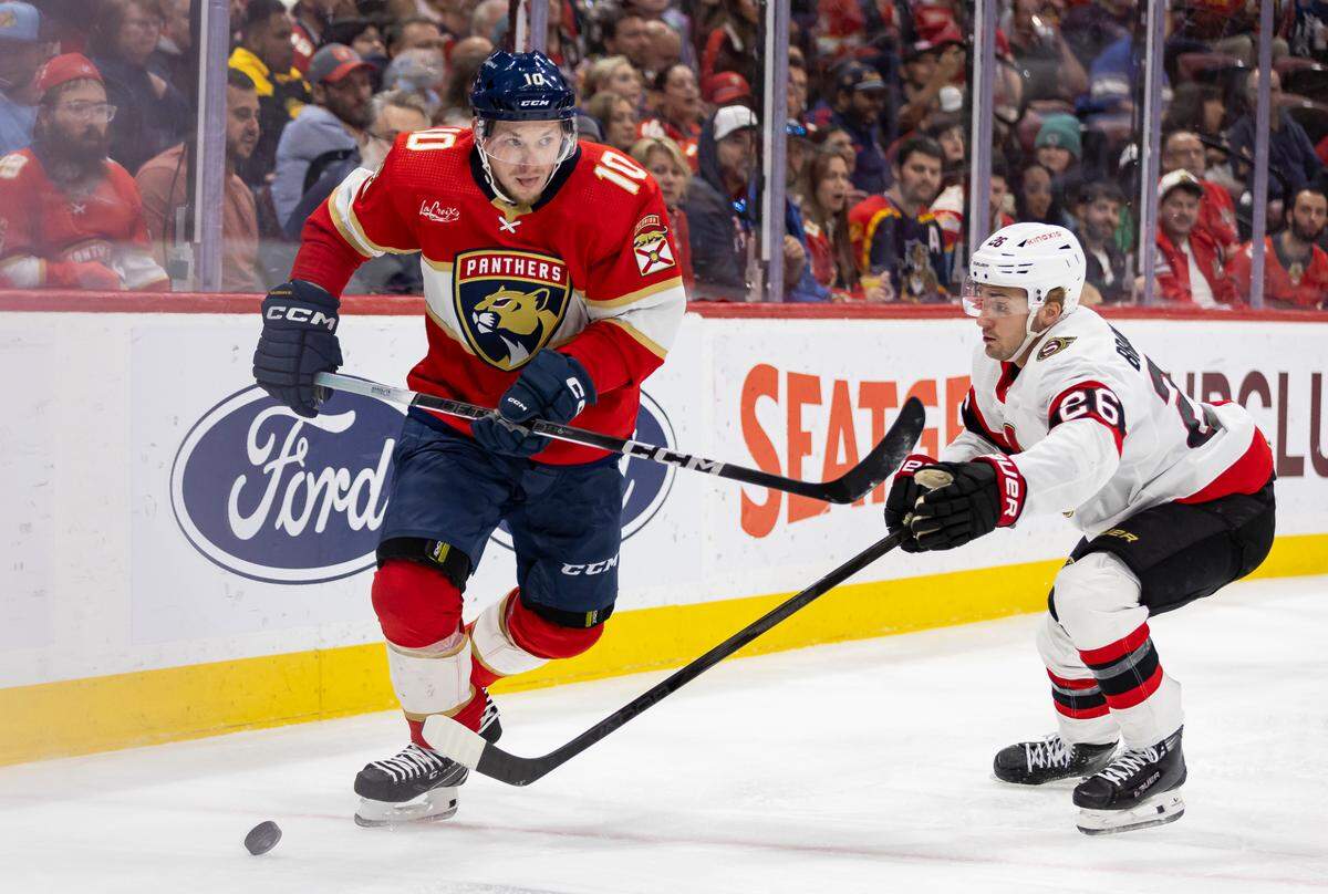 Florida Panthers right wing Vladimir Tarasenko (10) skates with the puck as Ottawa Senators defenseman Erik Brannstrom (26) defends in the second period of their NHL game at Amerant Bank Arena on Tuesday, April 9, 2024, in Sunrise, Fla.
