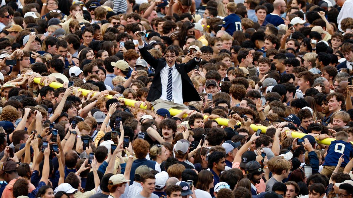 Georgia Tech football fans rip down the goal post and celebrate on the field after defeating the Miami Hurricanes during an NCAA game at Bobby Dodd Stadium at Hyundai Field in Atlanta, Georgia on Saturday, November 9, 2024.