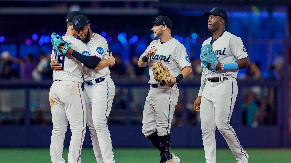 Jun 4, 2023; Miami, Florida, USA; Miami Marlins left fielder Bryan De La Cruz (14) celebrates with shortstop Joey Wendle (18) after winning the game against the Oakland Athletics at loanDepot Park. Mandatory Credit: Sam Navarro-USA TODAY Sports