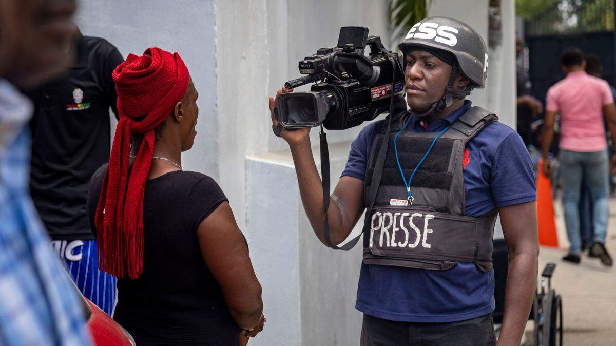Haitian Journalists in August 2024 wait for then-Haitian Prime Minister Garry Conille to arrive at Bernard Mevs Hospital to visit wounded policemen. Months later, Conille would be replaced and the hospital burned and pillaged by armed gangs.