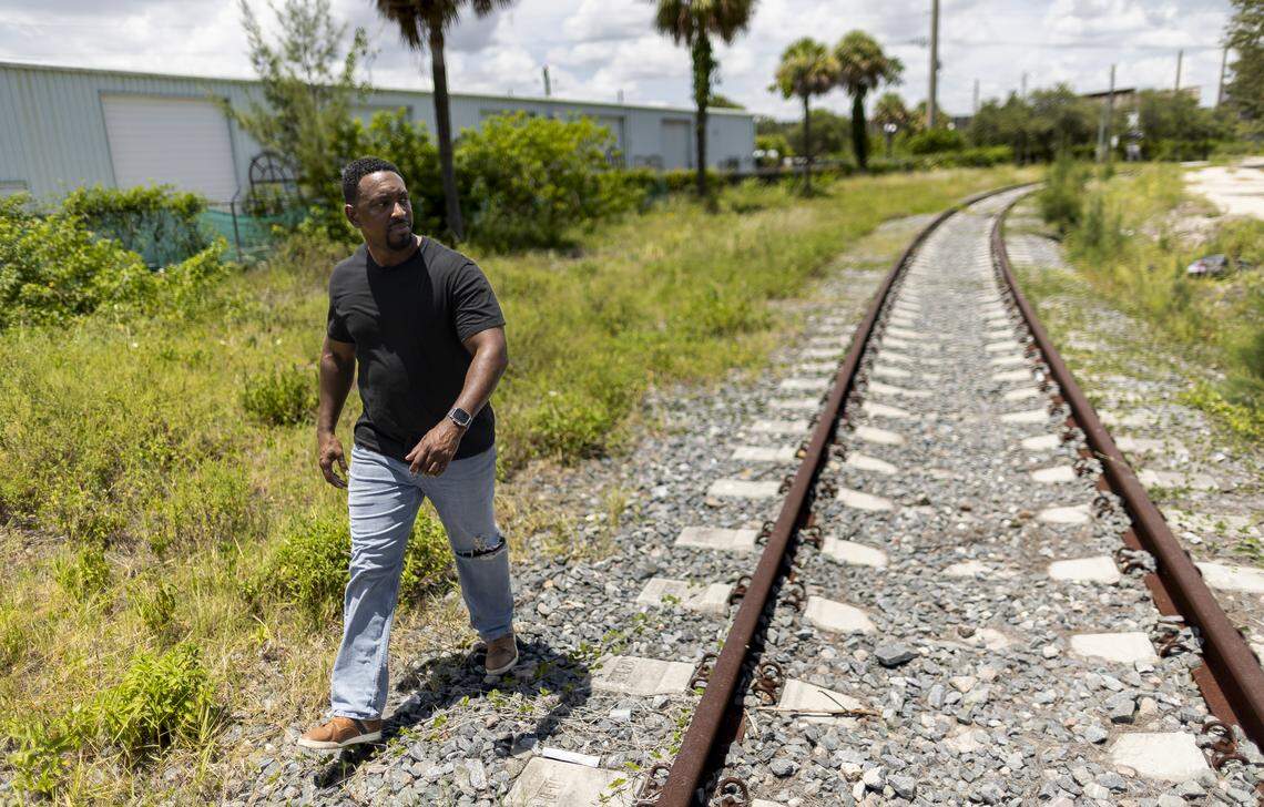 Darren Brown, who worked as a Brightline conductor from 2017 through 2023, stands near train tracks in West Palm Beach in July.