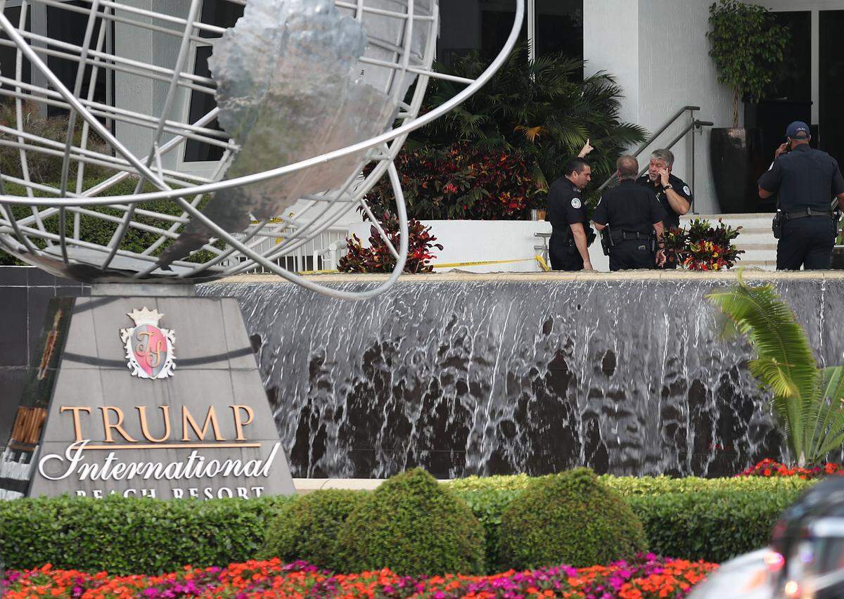 Sunny Isles Beach police officers work near the entrance to the Trump International Beach Resort on May 12, 2019, after a shooting that reportedly targeted rapper NBA YoungBoy on the street in front of the resort.