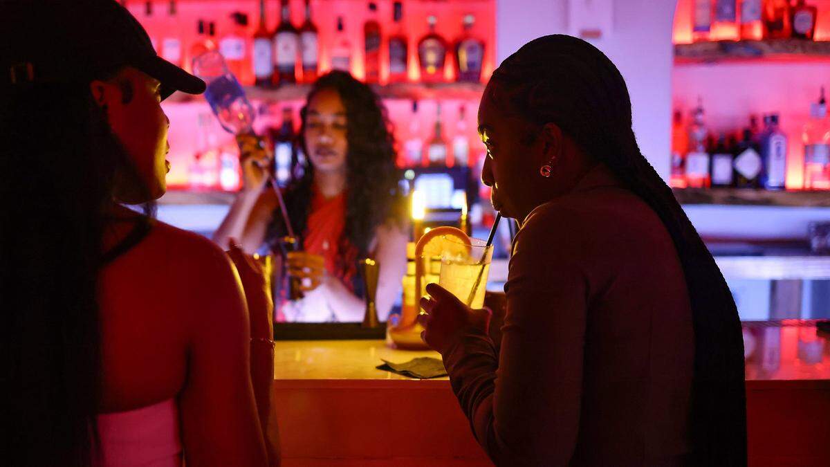 Guests enjoy a cocktail and conversation at the bar as Kyle Hoto Reid, founder of Love Language Presents hosts a party focused on intimacy and low-key aesthetics at Bargean in Little Havana, Miami, Florida on Sunday, April 5, 2026.