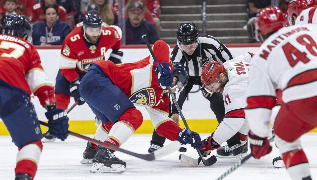 Florida Panthers center Aleksander Barkov (16) and Carolina Hurricanes center Jordan Staal (11) face-off in the first period of Game 3 during the Eastern Conference final of the NHL Stanley Cup playoffs at Amerant Bank Arena on Saturday, May 24, 2025, in Sunrise, Fla.