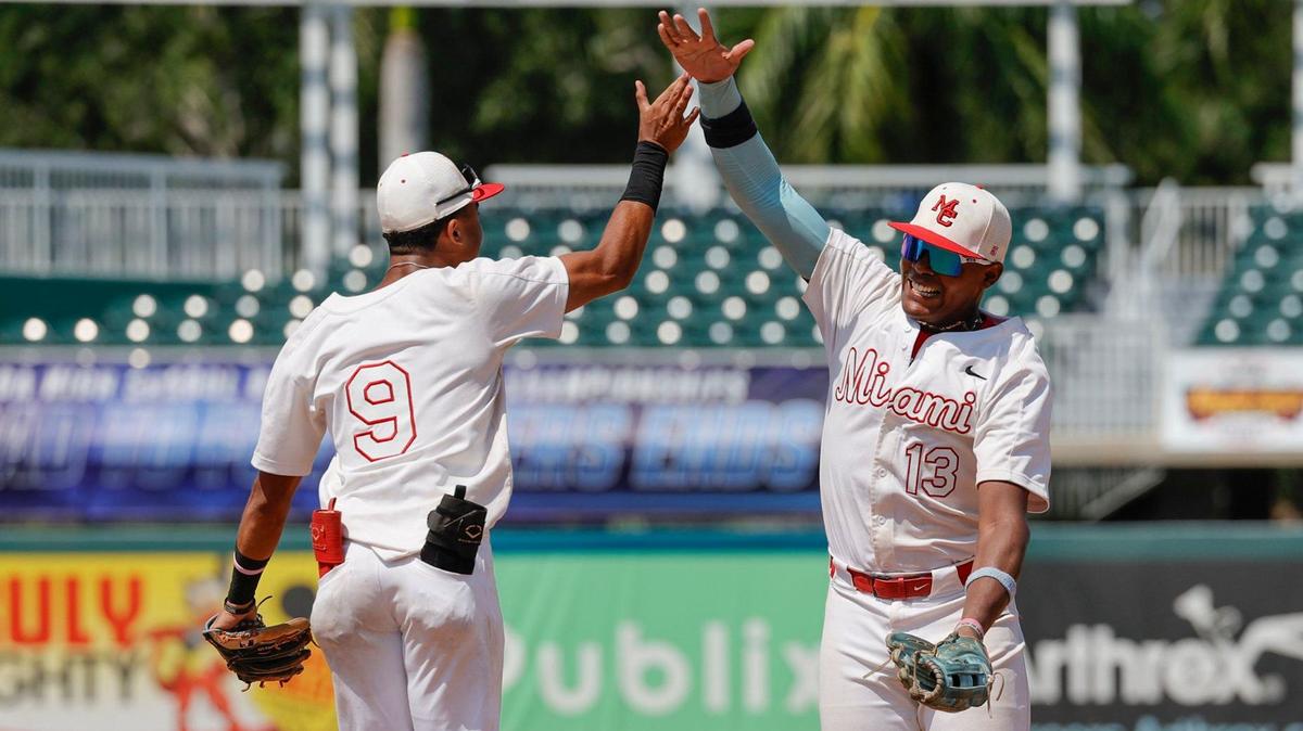 Miami Christian Victors shortstop Ronny Cruz (9) and left fielder Christian De Los Santos (13) celebrate after the team defeats Orlando First Academy Royals baseball in FHSAA Class 2A state baseball semifinal at Hammond Stadium in Fort Myers, Florida on Monday, May 20, 2024.