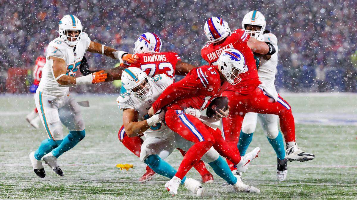 Buffalo Bills quarterback Josh Allen (17) is being sacked by Miami Dolphins defensive tackle Zach Sieler (92) during fourth quarter of an NFL football game at Highmark Stadium on Saturday, December 17, 2022 in Orchard Park, New York.