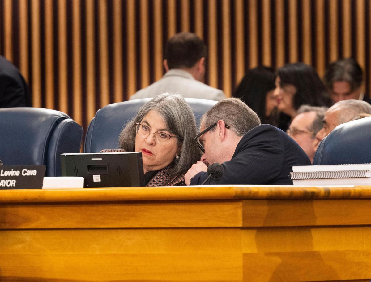 Miami-Dade Mayor Levine Cava talks with her budget director, David Clodfelter, during the first Miami-Dade county budget hearing on Thursday, Sept. 8, 2022, at the Stephen P. Clark Government Center in Downtown Miami.