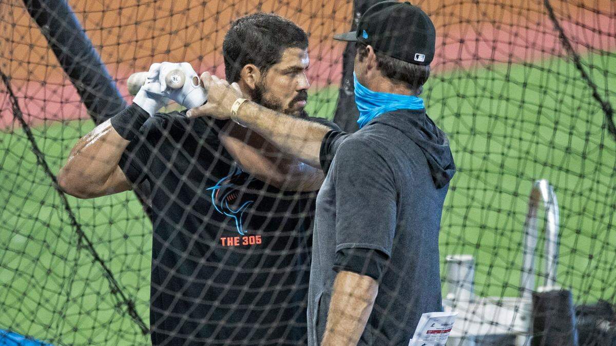 Jorge Alfaro (38) gets coached by hitting coach Eric Duncan during batting practice at Marlins training camp at Marlins Park on Saturday, July 4, 2020.