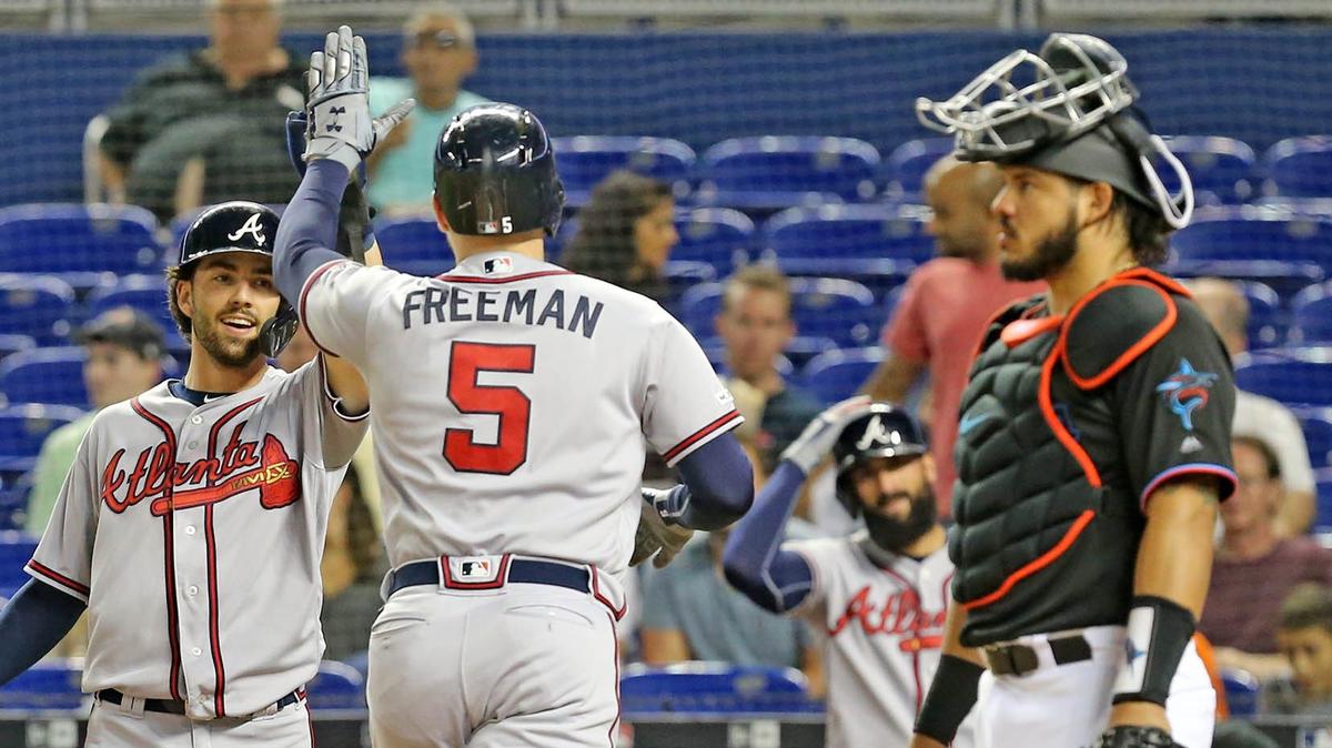 Miami Marlins catcher Jorge Alfaro (38) watches as Atlanta Braves Freddie Freeman (5) celebate after a first inning home run at Marlins Park in Miami, Florida, Friday, June, 7, 2019.