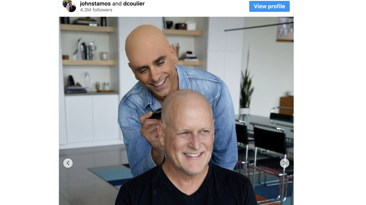 John Stamos wears a bald cap while shaving Dave Coulier’s head.