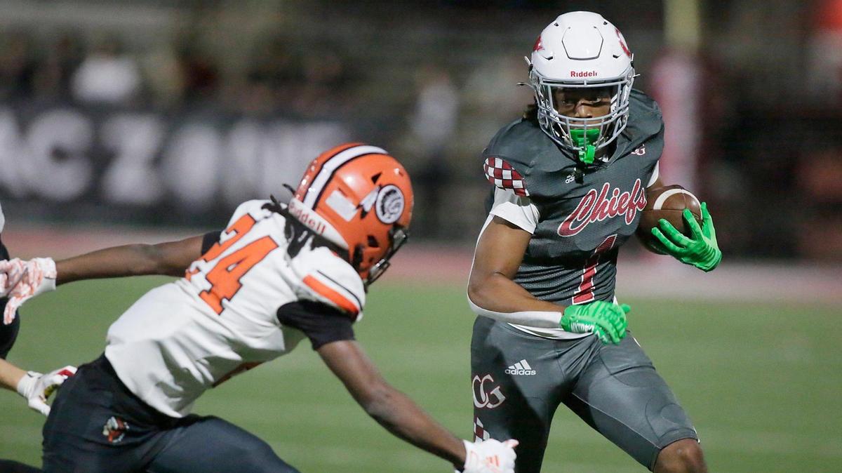 Cardinal Gibbons Chiefs wide receiver Brian Williams (1) carries the ball against Carol City Chiefs during regional quarterfinal football game on Friday, November 15, 2024 at Cardinal Gibbons HS in Fort Lauderdale. Andrew Uloza / for Miami Herald