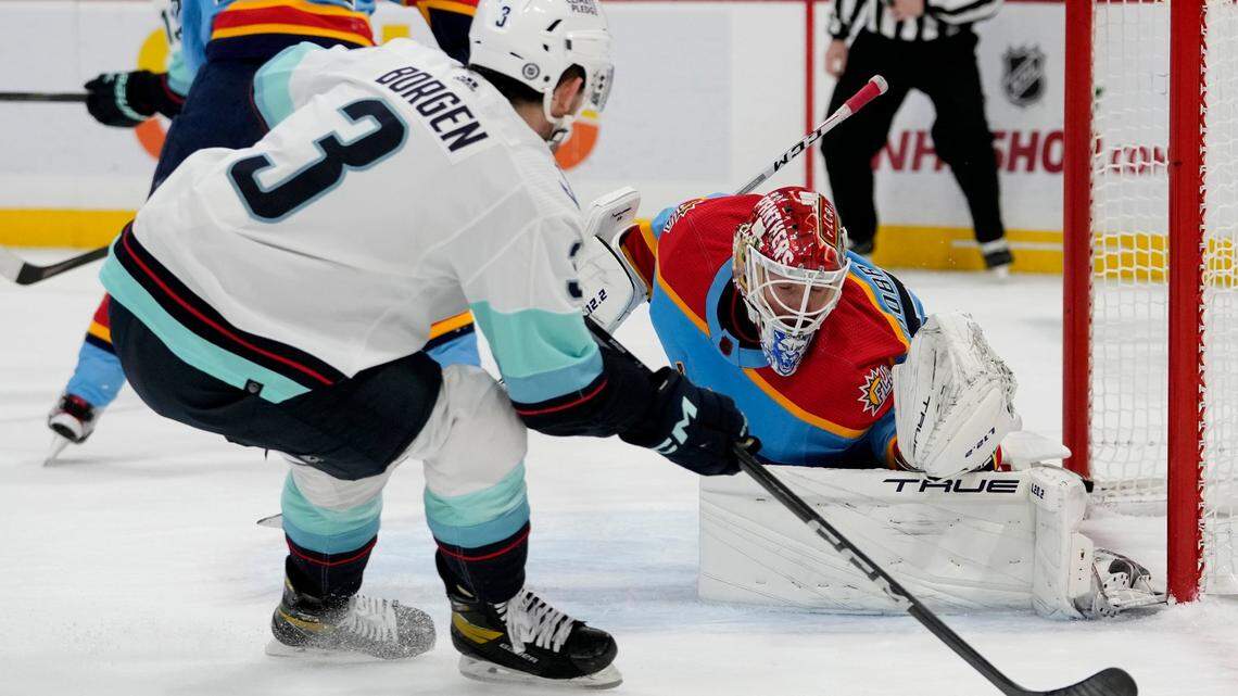 Florida Panthers goaltender Sergei Bobrovsky, right, defends the goal against Seattle Kraken defenseman Will Borgen (3) during the first period of an NHL hockey game, Sunday, Dec. 11, 2022, in Sunrise, Fla. (AP Photo/Lynne Sladky)