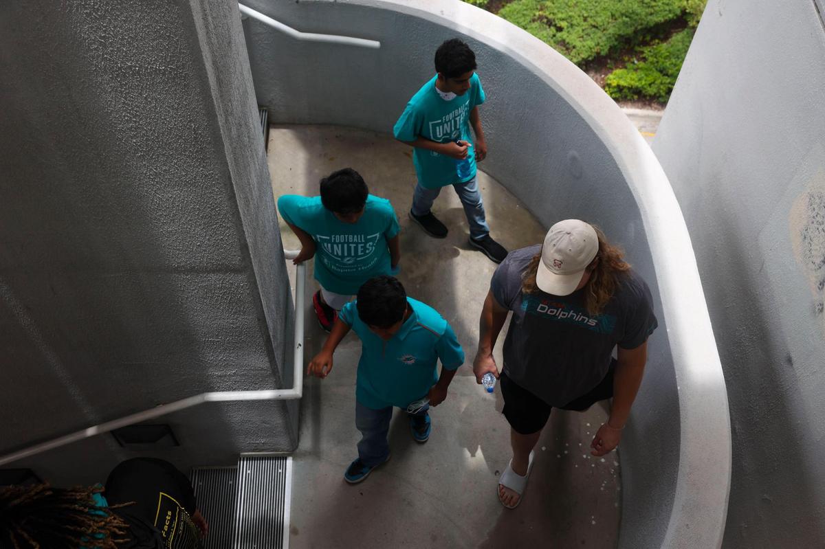 Blaise Andries, right, offensive lineman of the Miami Dolphins rookie class, walks with youth from the Islamic Center of Greater Miami in a historic walking tour of Downtown Miami on Wednesday, June 15, 2022, beginning with tour leaders at the History Miami Museum. Andries played at the University of Minnesota.