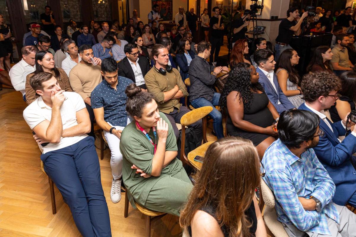 Audience members listen to pitches during “The Big Pitch Night” event at Mindspace Miami on Tuesday, Nov. 19, 2024, in Miami.