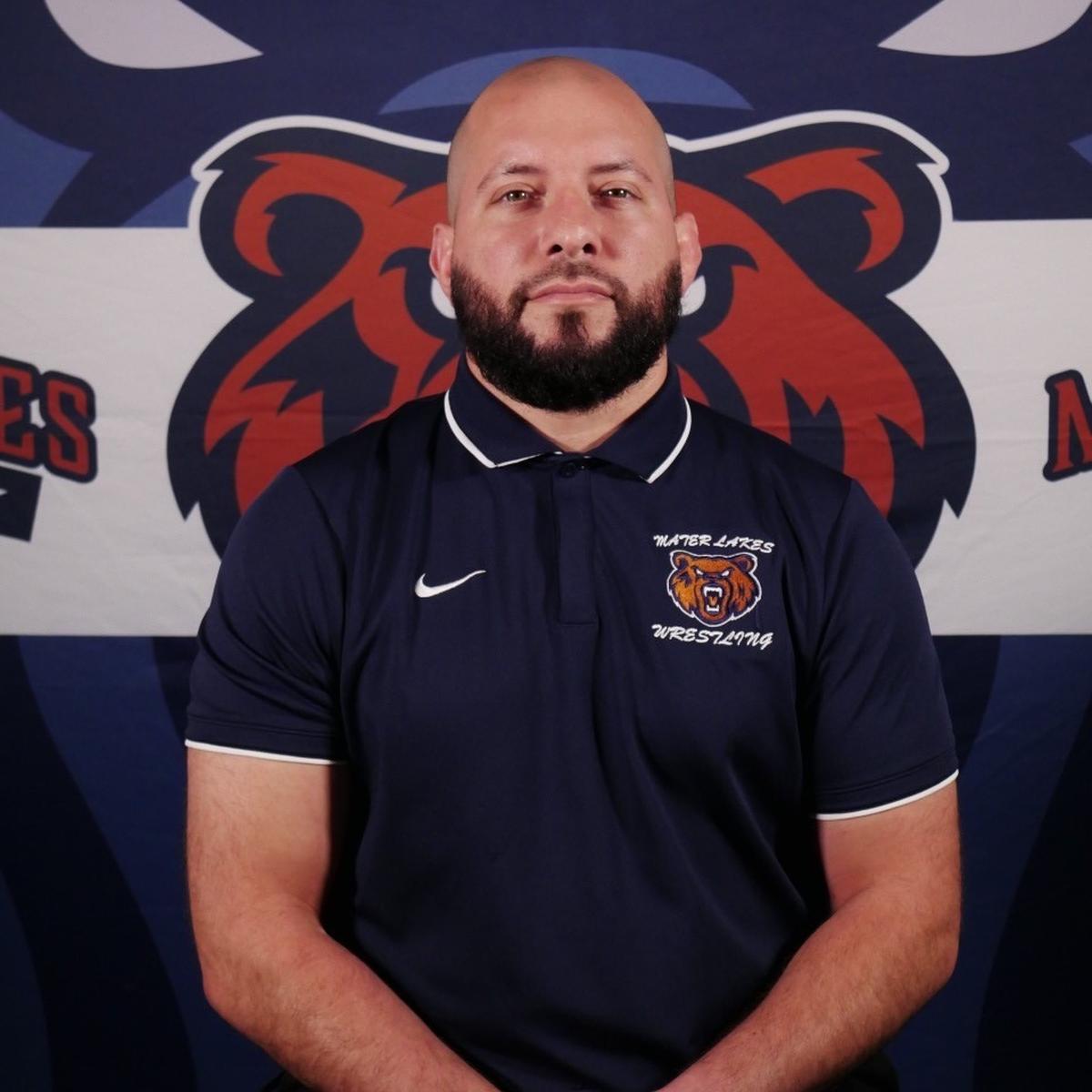 Mater Lakes coach Brandon Neifeld led his team to its first state championships in both the Duals and individually-bracketed wrestling meets this past season.