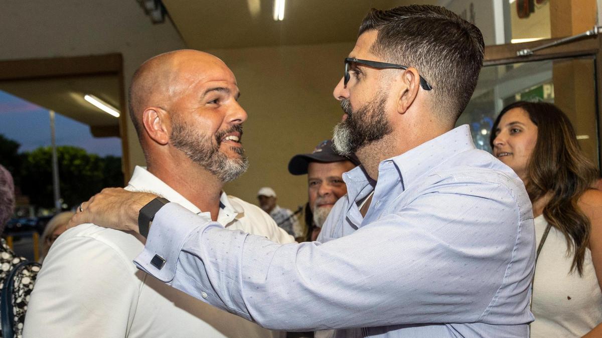 Miami, Florida, August 23, 2022 - Roberto Alonso, left, is congratulated by Manny Diaz Jr., Florida Commissioner of Education, during a celebration party at Paraiso Tropical in Hialeah. Alonso, running for the Miami-Dade School Board’s District 4 seat, was endorsed by Florida Gov. Ron DeSantis. As of late Tuesday, he had won with more than 57 percent of the vote. The seat was open due to the longtime chair Perla Tabares Hantman not seeking reelection. Alonso defeated two other candidates.