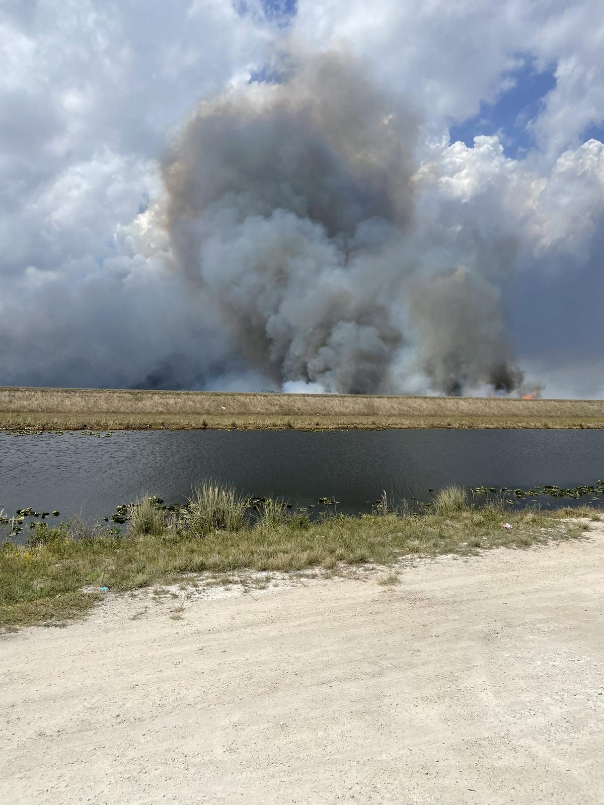 New brush fire sparks in west Miami-Dade, past Krome Avenue, burning 6,500 acres of conservation area. Officials are still focused on a growing fire near homes.