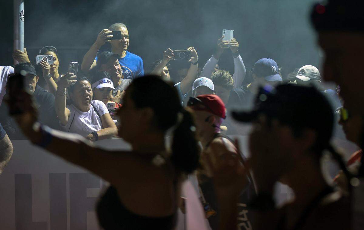 Spectators watch 18,000 athletes and runners participate in the 2025 Life Time Miami Marathon and Half on Feb. 2, 2025, in downtown Miami, Florida.
