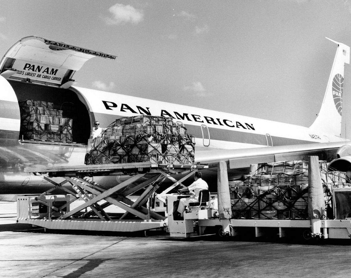 A 32-ton shipment of plantains is unloaded from a Pan Am Jet Freighter at Miami upon arrival from Caracas.