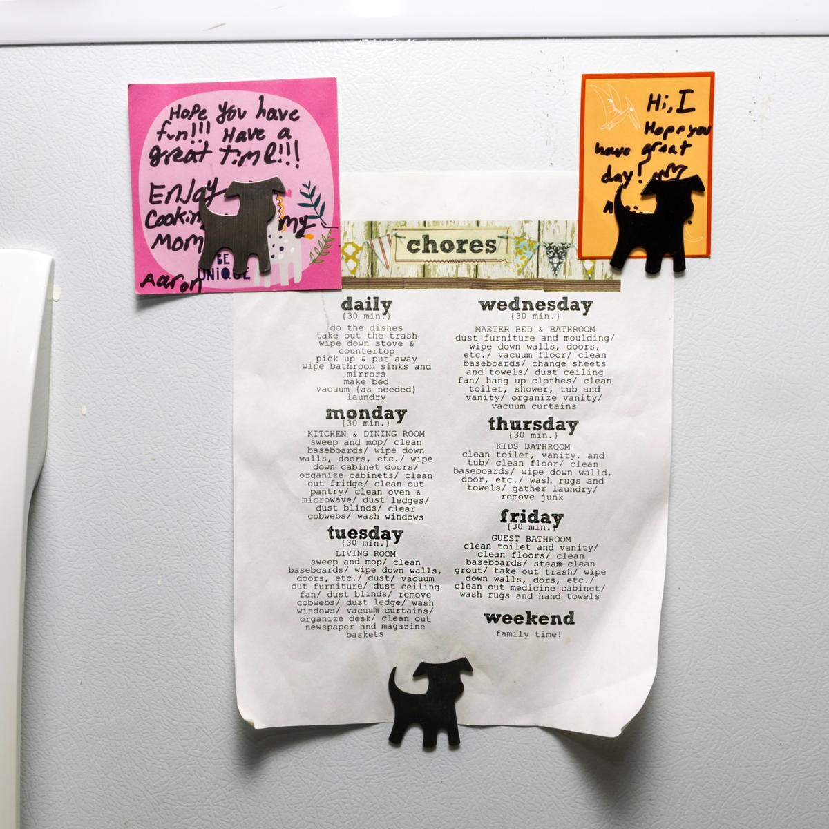 A chore sheet hangs from the fridge inside the shared kitchen at Saint House on Monday, October 21, 2024, in Miami, Fla. Saints House is a transitional housing program for those aging out of foster care.