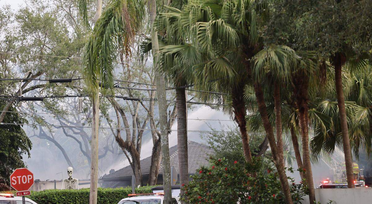 Smoke and water on the scene of the massive blaze Thursday morning at Erik Spoestra’s home.