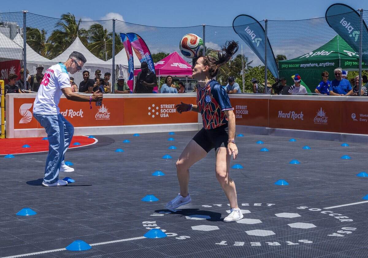 Football freestyle star Laura Biondo practices before a Guinness World Record event where soccer fans around the world juggled a ball in unison for 10 seconds at Lummus Park in Miami Beach on Saturday.