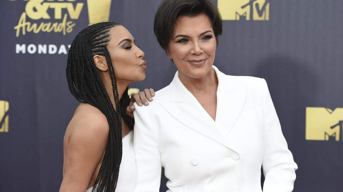 Kim Kardashian West, left, and Kris Jenner arrive at the MTV Movie and TV Awards at the Barker Hangar on Saturday, June 16, 2018, in Santa Monica, Calif.