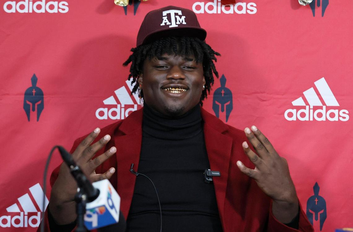 Monsignor Edward Pace defensive end Shemar Stewart reacts after choosing to sign with Texas A&M University football during National Signing Day at Monsignor Edward Pace High School in Miami Gardens, Florida, on Wednesday, February 2, 2022.
