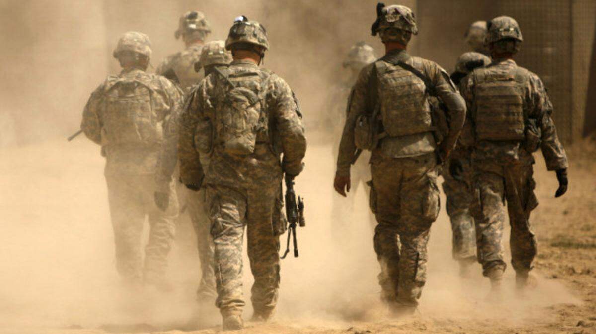 U.S. soldiers in the 101st Airborne Division leave patrol in the Afghan province of Kandahar.